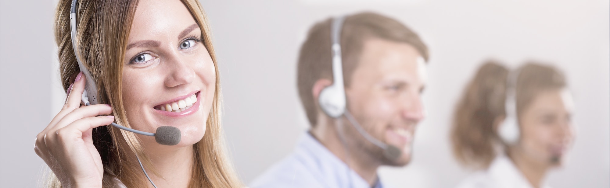 Woman with headphones working in call centre